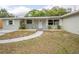 Charming single-story home with a quaint front entrance and manicured landscaping at 2332 S Crystal Lake Dr, Lakeland, FL 33801