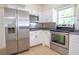 The kitchen is equipped with modern stainless steel appliances and ample counter space at 2332 S Crystal Lake Dr, Lakeland, FL 33801