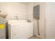 An efficient laundry room is equipped with essential appliances and accessible utilities at 2332 S Crystal Lake Dr, Lakeland, FL 33801