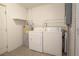 A conveniently placed laundry room features a modern washer, dryer, and water heater at 2332 S Crystal Lake Dr, Lakeland, FL 33801