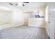 View of the light-filled living room with kitchen and entry access at 2332 S Crystal Lake Dr, Lakeland, FL 33801