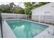 A refreshing in-ground pool, perfect for relaxation and entertainment, is fully fenced at 2332 S Crystal Lake Dr, Lakeland, FL 33801