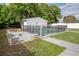 A fenced in in-ground pool with a stone accented seating area at 2332 S Crystal Lake Dr, Lakeland, FL 33801