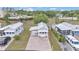 Charming home with brick driveway, carport, and colorful flower pots at 2511 Limewood Ave, Clermont, FL 34714