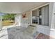 Features covered porch with concrete steps leading to the entry and stamped concrete patio at 2511 Limewood Ave, Clermont, FL 34714