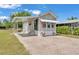 Charming home featuring a covered porch, awning, and brick paved driveway at 2511 Limewood Ave, Clermont, FL 34714