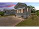 Charming manufactured home with brick paved drive, flowers and sunset view at 2511 Limewood Ave, Clermont, FL 34714