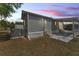 Charming home featuring an inviting covered porch and well-maintained exterior siding at 2511 Limewood Ave, Clermont, FL 34714