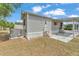 This home features a charming covered porch with a concrete patio and well-kept landscaping at 2511 Limewood Ave, Clermont, FL 34714