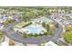 Aerial view of community pool and recreation area surrounded by lush landscaping at 2511 Limewood Ave, Clermont, FL 34714