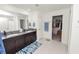 Spacious bathroom with dual vanities, granite countertops, and walk-in closet for modern comfort at 2726 Red Egret Dr, Bartow, FL 33830