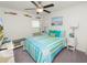 Inviting bedroom featuring striped bedding, coastal decor, and a bright, relaxing atmosphere at 2726 Red Egret Dr, Bartow, FL 33830