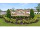 Elegant Wind Meadows South community sign surrounded by lush landscaping and trees at 2726 Red Egret Dr, Bartow, FL 33830