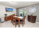 Cozy dining room with a wood table, chairs, and a sliding door leading to outdoor space at 2726 Red Egret Dr, Bartow, FL 33830