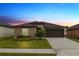 Charming single-story home with a well-manicured lawn, complemented by a two car garage and beautiful landscaping at 2726 Red Egret Dr, Bartow, FL 33830