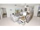Bright living room features tile flooring, a ceiling fan, and ample space for seating and entertaining at 2726 Red Egret Dr, Bartow, FL 33830