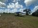Community playground with shade covering and benches in a grass park area at 2726 Red Egret Dr, Bartow, FL 33830