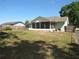 Well-maintained backyard with a screened in porch at 281 Glenridge S Loop, Lakeland, FL 33809
