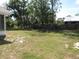 The fenced backyard has plenty of lawn space and mature shade trees at 281 Glenridge S Loop, Lakeland, FL 33809