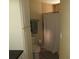 A functional bathroom features a shower with a tub and convenient storage at 281 Glenridge S Loop, Lakeland, FL 33809
