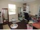 Bright bedroom features a desk, shelving unit and an abundance of natural light at 281 Glenridge S Loop, Lakeland, FL 33809