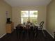 A casual dining space is filled with natural light streaming through the window at 281 Glenridge S Loop, Lakeland, FL 33809