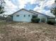 The home's side exterior is a light green hue with white trim and a fenced in yard at 281 Glenridge S Loop, Lakeland, FL 33809