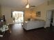 Cozy living room featuring wood floors, sliding glass doors and neutral decor at 281 Glenridge S Loop, Lakeland, FL 33809