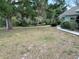 Spacious yard with mature trees, sidewalk, and lush greenery surrounding the property at 281 Glenridge S Loop, Lakeland, FL 33809
