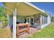 Outdoor patio featuring brick flooring and views of backyard, perfect for relaxation at 2836 Magnolia Ave, Lakeland, FL 33812