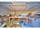 Unfinished basement with wooden work tables and ample room for storage at 2836 Magnolia Ave, Lakeland, FL 33812