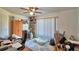 Bedroom with ceiling fan, natural light from window, and ample closet space at 2836 Magnolia Ave, Lakeland, FL 33812