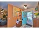 Inviting foyer with a bright blue door, tile flooring, and colorful decor providing a warm welcome at 2836 Magnolia Ave, Lakeland, FL 33812
