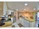 The bright kitchen features an island with sink and eat-in kitchen table at 2836 Magnolia Ave, Lakeland, FL 33812