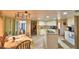 Kitchen with white cabinetry, tiled floor, large island, and stainless steel sink at 2836 Magnolia Ave, Lakeland, FL 33812