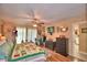 Spacious main bedroom with laminate flooring, modern ceiling fan, and access to the en-suite bathroom at 2836 Magnolia Ave, Lakeland, FL 33812