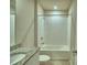 Bathroom featuring a shower over bath, with a granite top vanity with sink, and a tiled shower and floor at 3208 Weitzel Dr, Haines City, FL 33844
