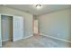 Bedroom with carpet, closet, and neutral paint at 3208 Weitzel Dr, Haines City, FL 33844
