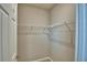 A closet with a sturdy white wire shelf and rod system, providing ample storage space for clothing and accessories at 3208 Weitzel Dr, Haines City, FL 33844