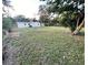 Large grassy backyard with mature trees, and storage shed at 3227 Decatur Ave, Lakeland, FL 33805