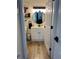 Bright half bathroom with wood look floors, white vanity and matte black fixtures at 3227 Decatur Ave, Lakeland, FL 33805
