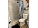 Updated bathroom featuring a walk-in shower with stylish fixtures and a modern toilet at 3227 Decatur Ave, Lakeland, FL 33805