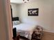 Cozy bedroom with decorative artwork and hardwood floors at 3227 Decatur Ave, Lakeland, FL 33805