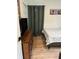 Bedroom includes wood-look flooring, decor, and large dresser at 3227 Decatur Ave, Lakeland, FL 33805