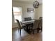 Elegant dining room featuring a dark wood table, comfortable seating, and natural light at 3227 Decatur Ave, Lakeland, FL 33805