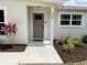 Inviting front entry with stylish landscaping and a welcoming painted front door at 3227 Decatur Ave, Lakeland, FL 33805