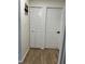 Hallway features include wood flooring, and doors including bi-fold doors at 3227 Decatur Ave, Lakeland, FL 33805