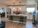 Modern kitchen with a central island, pendant lighting, and stainless steel appliances at 3227 Decatur Ave, Lakeland, FL 33805