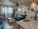 Comfortable living room with natural light, a cozy couch and seamless flow to other rooms at 3227 Decatur Ave, Lakeland, FL 33805