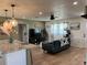Bright living room featuring a modern ceiling fan and an open layout at 3227 Decatur Ave, Lakeland, FL 33805